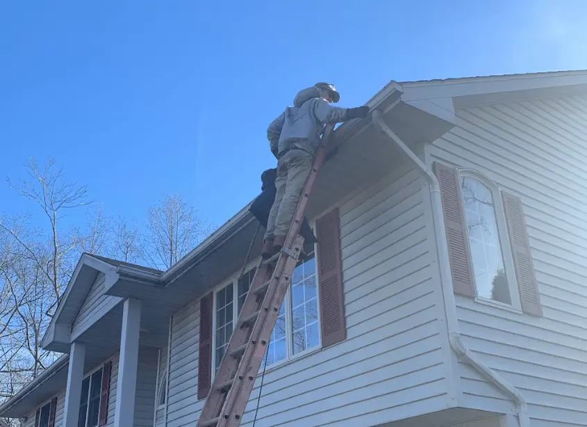 Gutter cleaning and maintenance being performed by Rocky River Power Washing in Rocky River